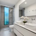 Bathroom with white ceramic sink and mirror