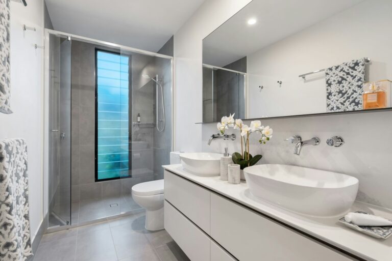 Bathroom with white ceramic sink and mirror