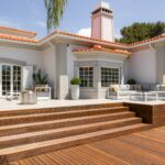 A beautiful house with decking and an outdoor patio.