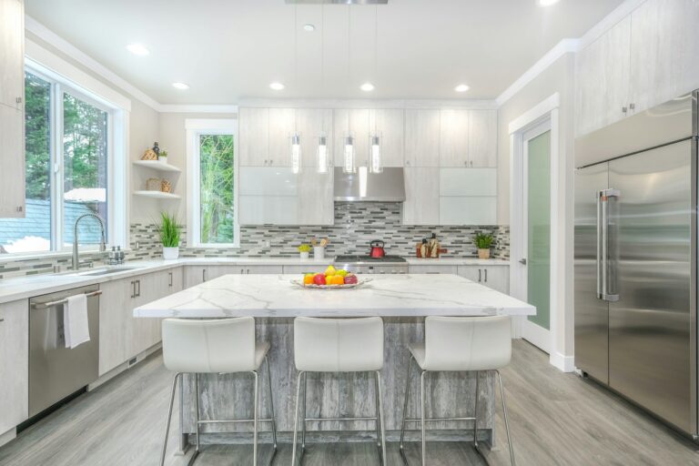 Kitchen with white wooden table and three chairs